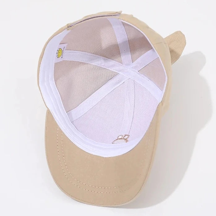 Introducing the adorable Bunny Ears Baseball Hat, available in pink, black, white, and khaki for children newborn to 3 years old! Perfect for adding a touch of cuteness to any outfit.