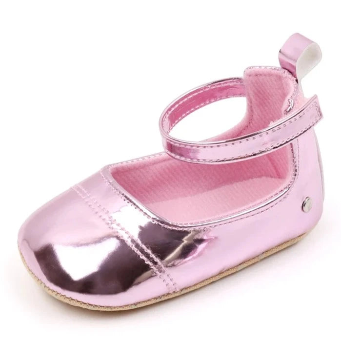 The perfect first time walker shoes for your little walker. Shower your little one's feet with style and comfort with our Bling Baby Shoes | Multiple Colors! Designed for newborns to 18 months, these shoes are perfect for your child's first steps. Supportive and durable, they'll keep your little walker's feet protected as they explore the world. Give them the confidence to take those first steps with our Bling Baby Shoes