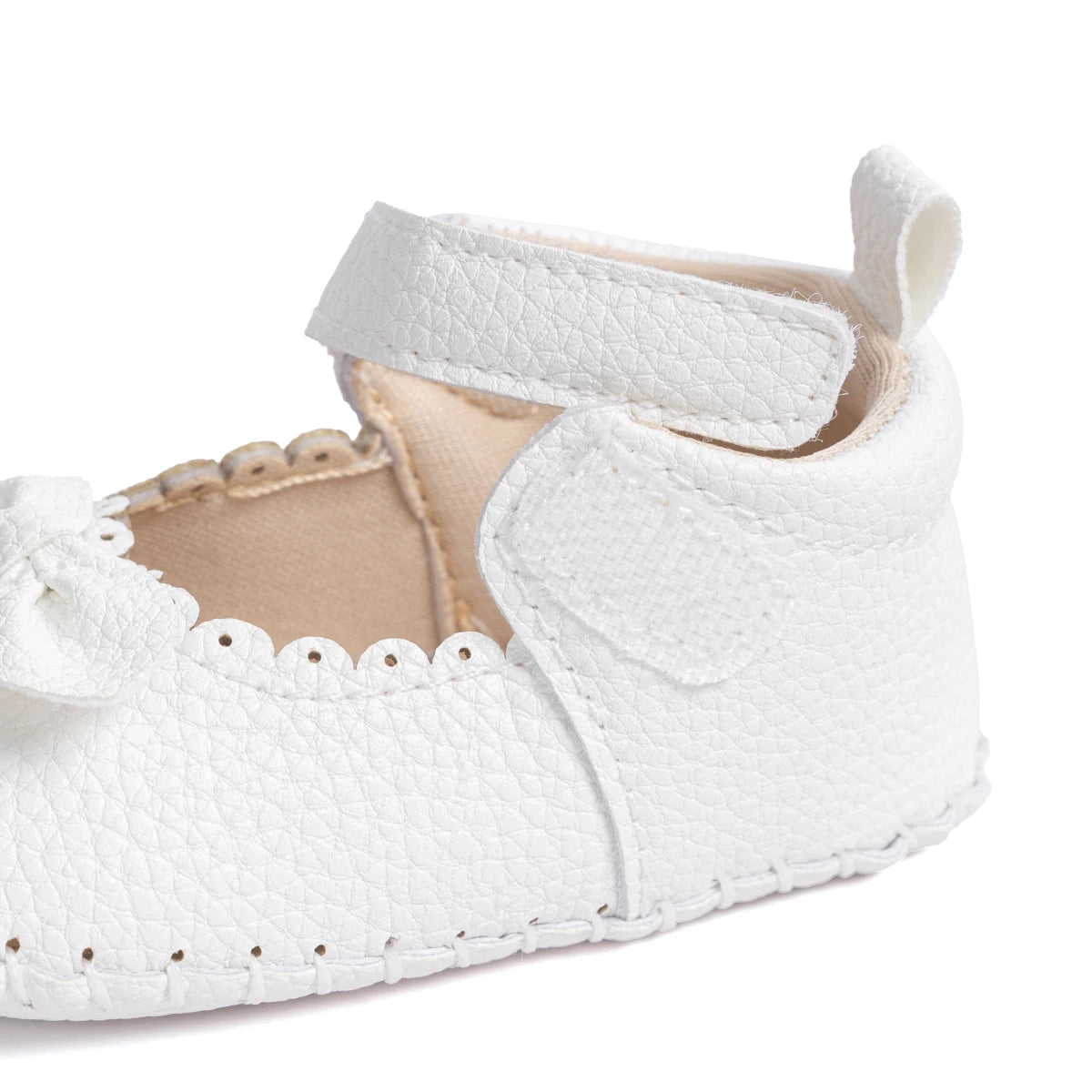 Designed with both style and comfort in mind, these Little Bow-Tie baby shoes are available in a variety of colors and sizes for newborns up to 18 months old. Each pair is meticulously crafted to provide a snug and secure fit for your little princess. Whether you're dressing them up for a special occasion or keeping them comfy for everyday wear, these shoes are the perfect choice for your little one.