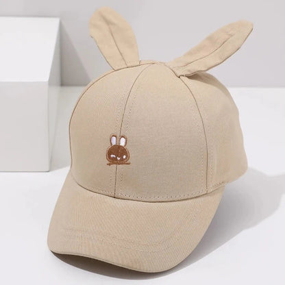 Introducing the adorable Bunny Ears Baseball Hat, available in pink, black, white, and khaki for children newborn to 3 years old! Perfect for adding a touch of cuteness to any outfit.