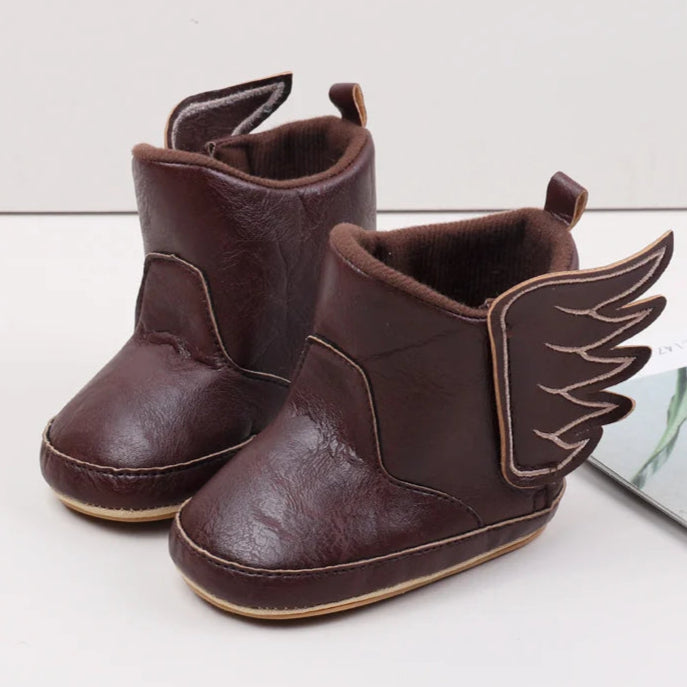 Designed with both style and comfort in mind, these baby wing boots are perfect for your little one from the moment they are born up to 18 months old. With multiple sizes and colors available, you'll have a pair for every occasion. Not only will they keep your baby's feet warm and cozy, but they'll also add a touch of fashion to their outfit. Expertly crafted with high-quality materials, these boots are durable and long-lasting, making them a practical choice for any parent.