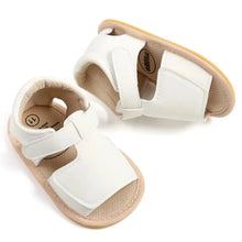 Load image into Gallery viewer, Made with soft materials and designed especially for newborns to 18 month olds, they are the perfect addition to any baby&#39;s wardrobe. Your little one will look and feel great while wearing these sandals, and you&#39;ll love the convenience of finding a quality pair of shoes that will grow with them. Don&#39;t miss out on giving your baby the best sandals for their growing feet!
