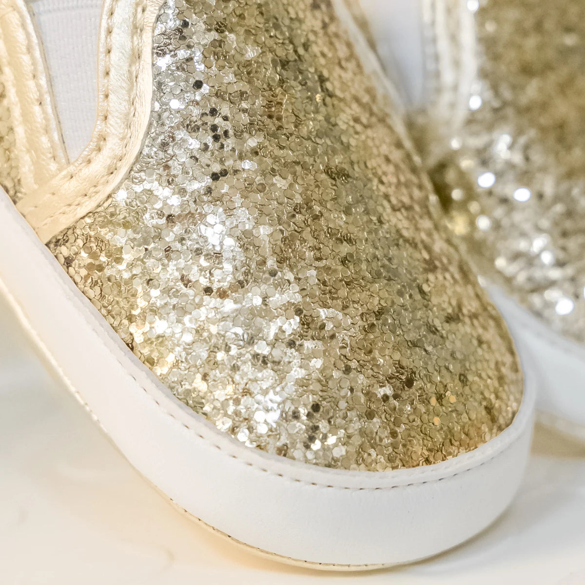 Not only will your little angel look fashionable in these stylish gold, silver and white baby loafers, but they will also stay safe and comfortable with their anti-slip, soft-sole design. Perfect for newborns up to 18 months, these shoes are easy to put on and take off, making your life as a busy parent a little easier. Provide your child with both fashion and function with our sparkling loafers in multiple colors and sizes.