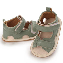 Load image into Gallery viewer, Indulge your little one in the ultimate comfort with our Valentina Baby Sandals, available in a variety of vibrant colors including green, black, white, and brown. Perfect for newborns up to 18 months, these stylish sandals are sure to make a statement and keep your baby&#39;s feet looking and feeling great..
