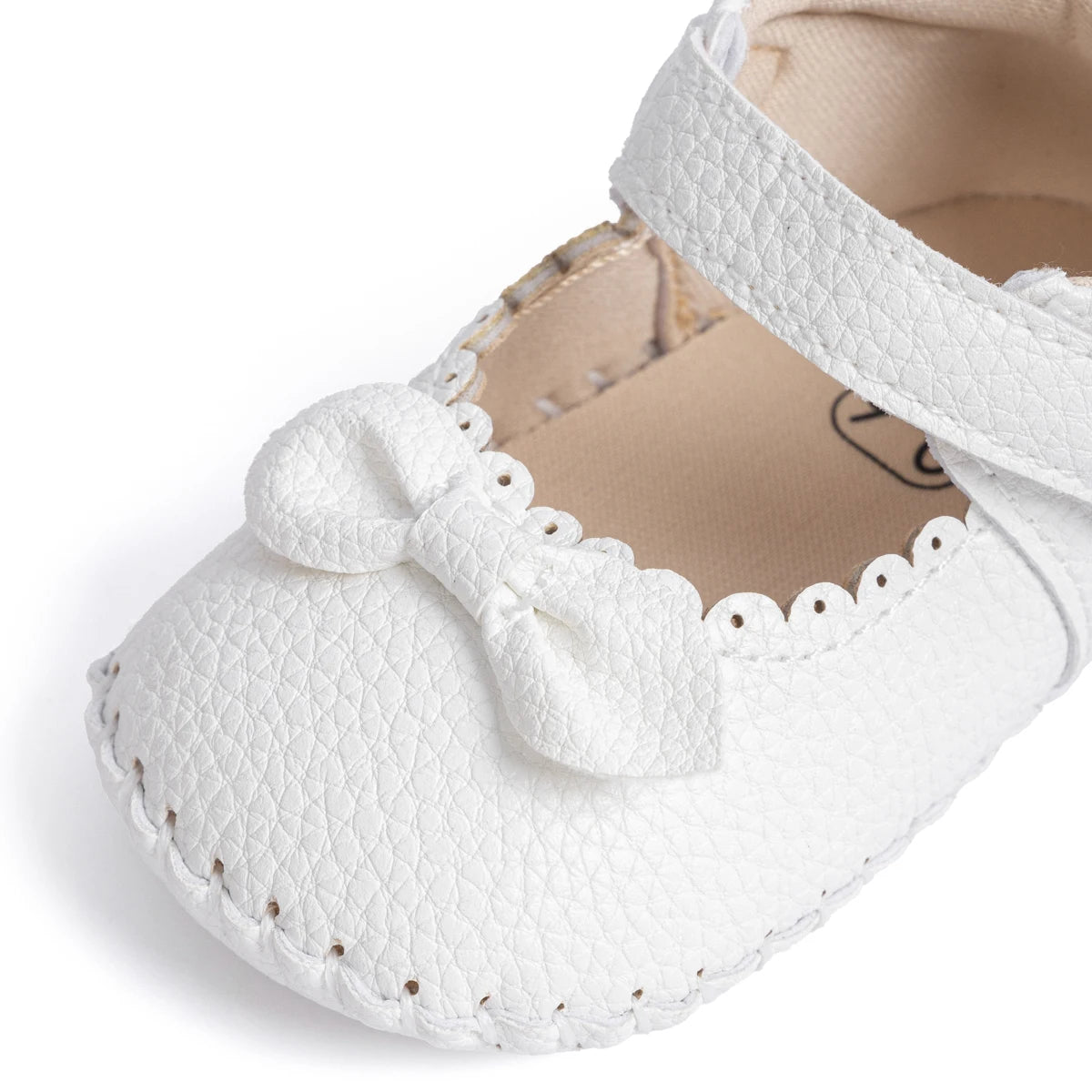 Designed with both style and comfort in mind, these Little Bow-Tie baby shoes are available in a variety of colors and sizes for newborns up to 18 months old. Each pair is meticulously crafted to provide a snug and secure fit for your little princess. Whether you're dressing them up for a special occasion or keeping them comfy for everyday wear, these shoes are the perfect choice for your little one.