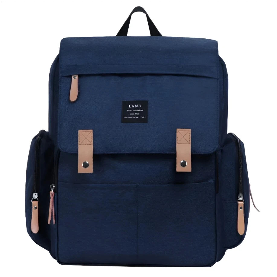 Expertly designed for busy parents, the Navy Blue Multifunctional Diaper Bag includes a thermal pocket to keep temperature-sensitive items safe and secure on the go. With this feature, you can rest assured that your baby's food, bottles, or medication will stay at the right temperature, no matter where you are or how long you're out.