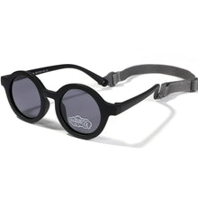 Load image into Gallery viewer, Indulge your little one&#39;s eyes with the ultimate protection and style of these polarized baby and toddler sunglasses! Perfect for ages 0-36 months, these round shades come with a flexible strap for added security and comfort. Whether your child is a newborn or an energetic toddler, these sunglasses are sure to keep their eyes safe and stylish!
