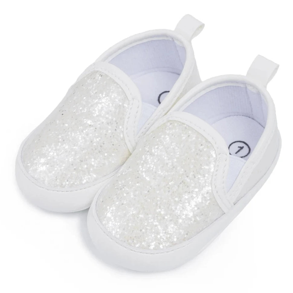 Not only will your little angel look fashionable in these stylish gold, silver and white baby loafers, but they will also stay safe and comfortable with their anti-slip, soft-sole design. Perfect for newborns up to 18 months, these shoes are easy to put on and take off, making your life as a busy parent a little easier. Provide your child with both fashion and function with our sparkling loafers in multiple colors and sizes.