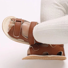 Load image into Gallery viewer, Indulge your little one in the ultimate comfort with our Valentina Baby Sandals, available in a variety of vibrant colors including green, black, white, and brown. Perfect for newborns up to 18 months, these stylish sandals are sure to make a statement and keep your baby&#39;s feet looking and feeling great..
