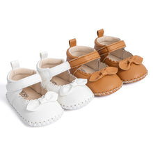 Load image into Gallery viewer, Designed with both style and comfort in mind, these Little Bow-Tie baby shoes are available in a variety of colors and sizes for newborns up to 18 months old. Each pair is meticulously crafted to provide a snug and secure fit for your little princess. Whether you&#39;re dressing them up for a special occasion or keeping them comfy for everyday wear, these shoes are the perfect choice for your little one.
