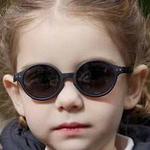 Load image into Gallery viewer, Experience the ultimate in sun protection for your little ones with our Ultra-light Baby and Toddler Sunglasses! These polarized, anti-UV shades are perfect for children ages 0-3 years. Keep your child&#39;s delicate eyes safe from harmful rays in retro round frames that are flexible and lightweight. Choose from multiple colors to fit your child&#39;s unique style. Trust us, these sunglasses are a must-have for any parent who values their child&#39;s well-being. Order now and see the difference they make!
