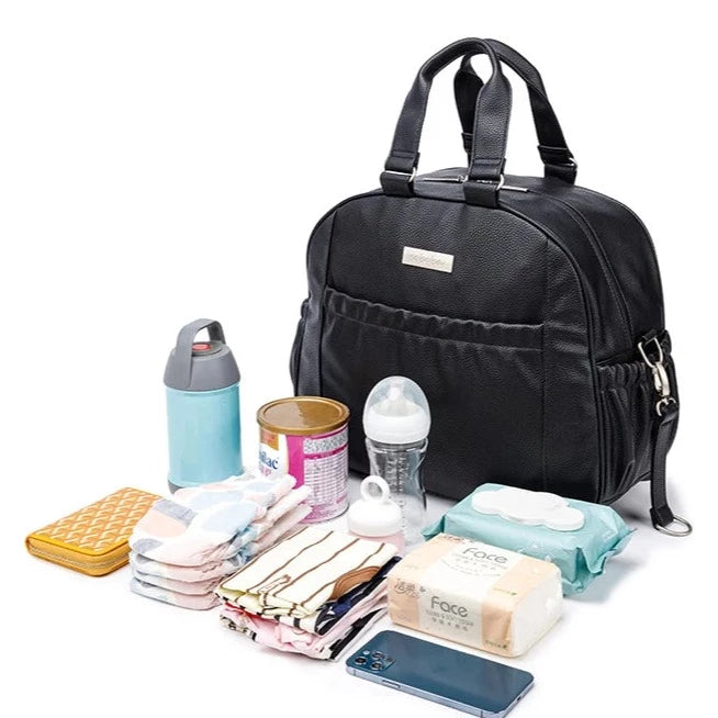 The Black Diaper Bag is a stylish and practical addition to any parent's arsenal of equipment. Constructed with durable fabrics, the bag can handle plenty of wear and tear and is a convenient way to store diapers and other necessities.