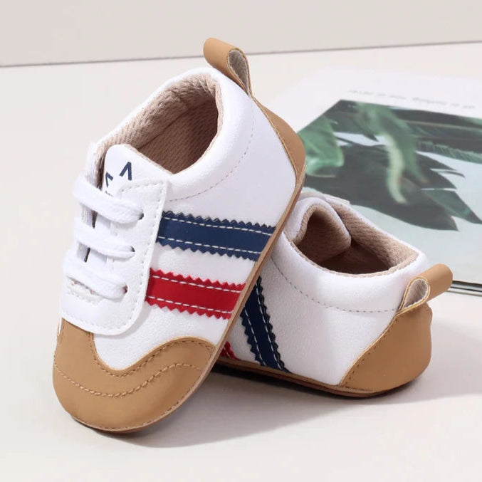 Designed with expert precision, these baby sneakers are crafted to fit children aged newborn through 18 months old with ultimate comfort and style.