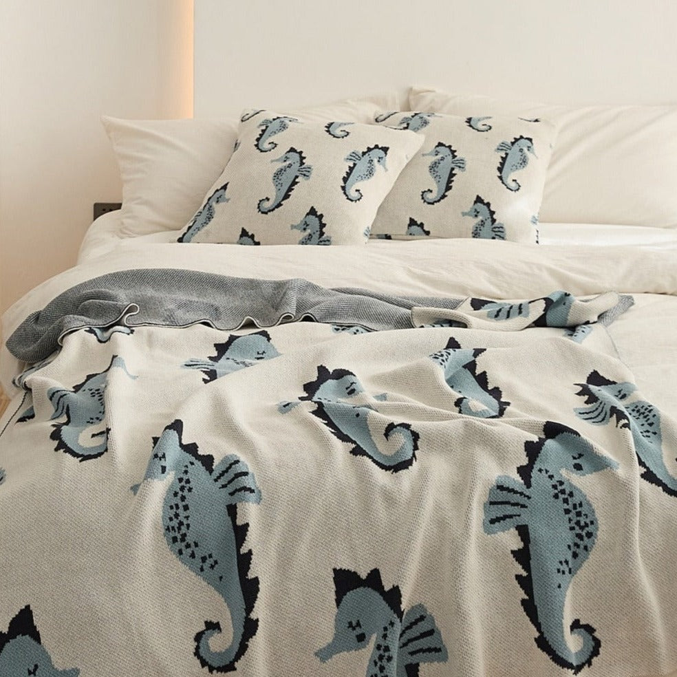 Snuggle up with an ocean of comfort! Our knitted sea horse cotton blanket is perfect for your little mermaid or sailor's bedroom or nursery. It's made of Grade A, 100% cotton with a yarn dyed pattern and comes in two cute colors: blue and pink. Yo-ho-ho and a pirate's hug! Size: 51.18 x 62.99 inches (130cm x 160cm).