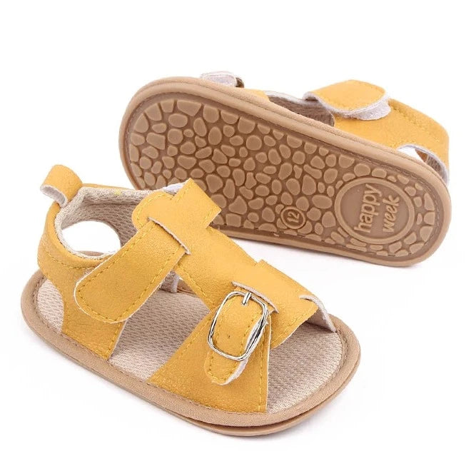 Bring comfort and style to your little one's summer with these adorable sandals in vibrant yellow, crisp white, and cool blue. Perfect for newborns to 18-month-olds, these sandals will have your baby looking cute from every angle. Elevate your baby's style with these adorable and versatile sandals! Keep your little one's feet cool and comfortable all summer long with these must-have sandals