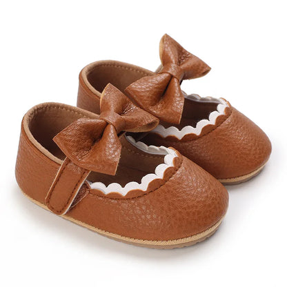 Indulge your little one's feet with our adorable Mary Jane baby shoes in a selection of sweet colors. Perfect for newborns through 18 months old, choose from white, black, apricot, and brown to match any outfit.