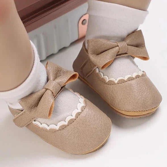 Indulge your little one's feet with our adorable Mary Jane baby shoes in a selection of sweet colors. Perfect for newborns through 18 months old, choose from white, black, apricot, and brown to match any outfit.