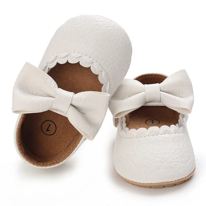 Indulge your little one's feet with our adorable Mary Jane baby shoes in a selection of sweet colors. Perfect for newborns through 18 months old, choose from white, black, apricot, and brown to match any outfit.