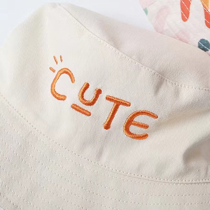 Cute two-sided beige and rainbow bucket hat. Just turn the hat around to create a different look for your child. This hat comes in 4 sizes. Strap Type: Adjustable. Material: Cotton and Polyester.    Head Circumference   18.89 inches (48cm) - Approximately 18 months to 3 years  19.68 inches(50cm) - Approximately 3 to 4 years   20.47 inches (52cm) - Approximately 4 to 5 years  21.25 inches (54cm) - Approximately 6 to 7 years