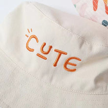 Load image into Gallery viewer, Cute two-sided beige and rainbow bucket hat. Just turn the hat around to create a different look for your child. This hat comes in 4 sizes. Strap Type: Adjustable. Material: Cotton and Polyester.    Head Circumference   18.89 inches (48cm) - Approximately 18 months to 3 years  19.68 inches(50cm) - Approximately 3 to 4 years   20.47 inches (52cm) - Approximately 4 to 5 years  21.25 inches (54cm) - Approximately 6 to 7 years
