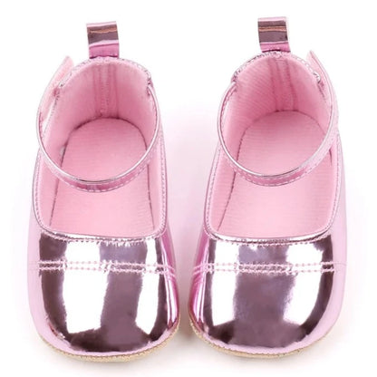 The perfect first time walker shoes for your little walker. Shower your little one's feet with style and comfort with our Bling Baby Shoes | Multiple Colors! Designed for newborns to 18 months, these shoes are perfect for your child's first steps. Supportive and durable, they'll keep your little walker's feet protected as they explore the world. Give them the confidence to take those first steps with our Bling Baby Shoes