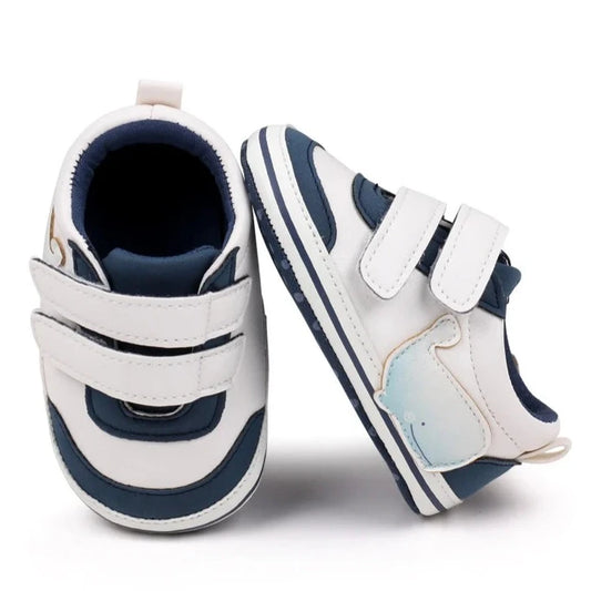 Non-slip casual shoes with soft soles. Introduce your little one to the joys of walking with our Sporty Baby Sneakers! Made for newborns to 18 months, these sneakers are perfect for first-time walkers. With non-slip soles and a comfortable fit, they provide both safety and style. Let your baby take their first steps in confidence with our Sporty Baby Sneakers