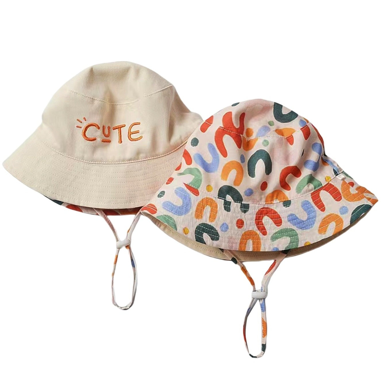 Cute two-sided beige and rainbow bucket hat. Just turn the hat around to create a different look for your child. This hat comes in 4 sizes. Strap Type: Adjustable. Material: Cotton and Polyester.    Head Circumference   18.89 inches (48cm) - Approximately 18 months to 3 years  19.68 inches(50cm) - Approximately 3 to 4 years   20.47 inches (52cm) - Approximately 4 to 5 years  21.25 inches (54cm) - Approximately 6 to 7 years