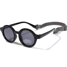 Load image into Gallery viewer, Indulge your little one&#39;s eyes with the ultimate protection and style of these polarized baby and toddler sunglasses! Perfect for ages 0-36 months, these round shades come with a flexible strap for added security and comfort. Whether your child is a newborn or an energetic toddler, these sunglasses are sure to keep their eyes safe and stylish!
