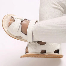 Load image into Gallery viewer, Indulge your little one in the ultimate comfort with our Valentina Baby Sandals, available in a variety of vibrant colors including green, black, white, and brown. Perfect for newborns up to 18 months, these stylish sandals are sure to make a statement and keep your baby&#39;s feet looking and feeling great..
