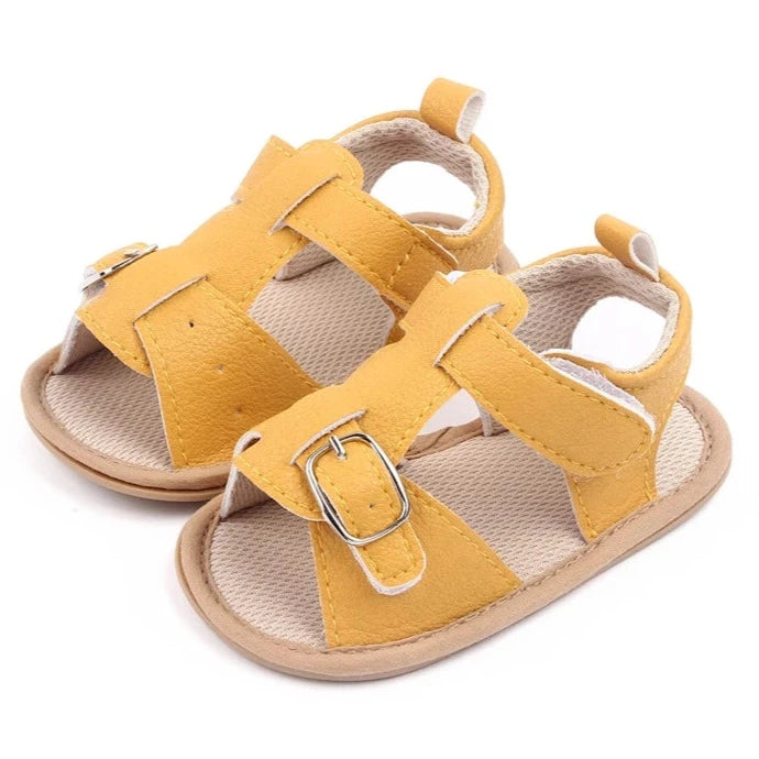 Bring comfort and style to your little one's summer with these adorable sandals in vibrant yellow, crisp white, and cool blue. Perfect for newborns to 18-month-olds, these sandals will have your baby looking cute from every angle. Elevate your baby's style with these adorable and versatile sandals! Keep your little one's feet cool and comfortable all summer long with these must-have sandals