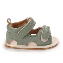 Load image into Gallery viewer, Indulge your little one in the ultimate comfort with our Valentina Baby Sandals, available in a variety of vibrant colors including green, black, white, and brown. Perfect for newborns up to 18 months, these stylish sandals are sure to make a statement and keep your baby&#39;s feet looking and feeling great..
