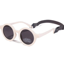 Load image into Gallery viewer, Indulge your little one&#39;s eyes with the ultimate protection and style of these polarized baby and toddler sunglasses! Perfect for ages 0-36 months, these round shades come with a flexible strap for added security and comfort. Whether your child is a newborn or an energetic toddler, these sunglasses are sure to keep their eyes safe and stylish!
