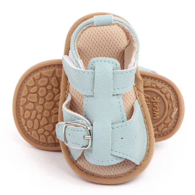 Bring comfort and style to your little one's summer with these adorable sandals in vibrant yellow, crisp white, and cool blue. Perfect for newborns to 18-month-olds, these sandals will have your baby looking cute from every angle. Elevate your baby's style with these adorable and versatile sandals! Keep your little one's feet cool and comfortable all summer long with these must-have sandals