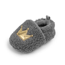 Load image into Gallery viewer, These cozy, snuggly slippers are fit for a royal baby! Made with fluffy teddy bear fabric to keep little toes warm and toasty. Available in sizes for newborns up to 18 months old. Choose from white, grey, or brown.
