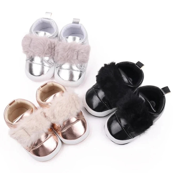 Discover the most adorable infant black gloss, silver or rose gold footwear available for newborns up to 18 months! Our selection boasts rose gold, glossy black, and shimmering silver options. These non-slip, cozy shoes feature soft soles perfect for everyday wear.