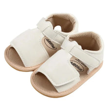 Load image into Gallery viewer, Made with soft materials and designed especially for newborns to 18 month olds, they are the perfect addition to any baby&#39;s wardrobe. Your little one will look and feel great while wearing these sandals, and you&#39;ll love the convenience of finding a quality pair of shoes that will grow with them. Don&#39;t miss out on giving your baby the best sandals for their growing feet!
