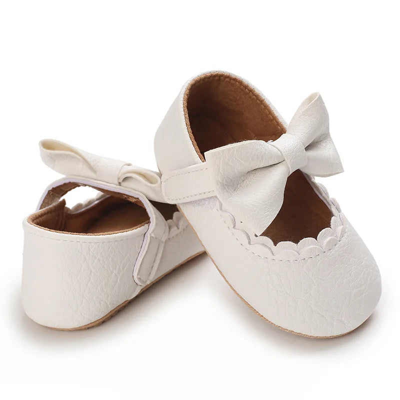 Indulge your little one's feet with our adorable Mary Jane baby shoes in a selection of sweet colors. Perfect for newborns through 18 months old, choose from white, black, apricot, and brown to match any outfit.