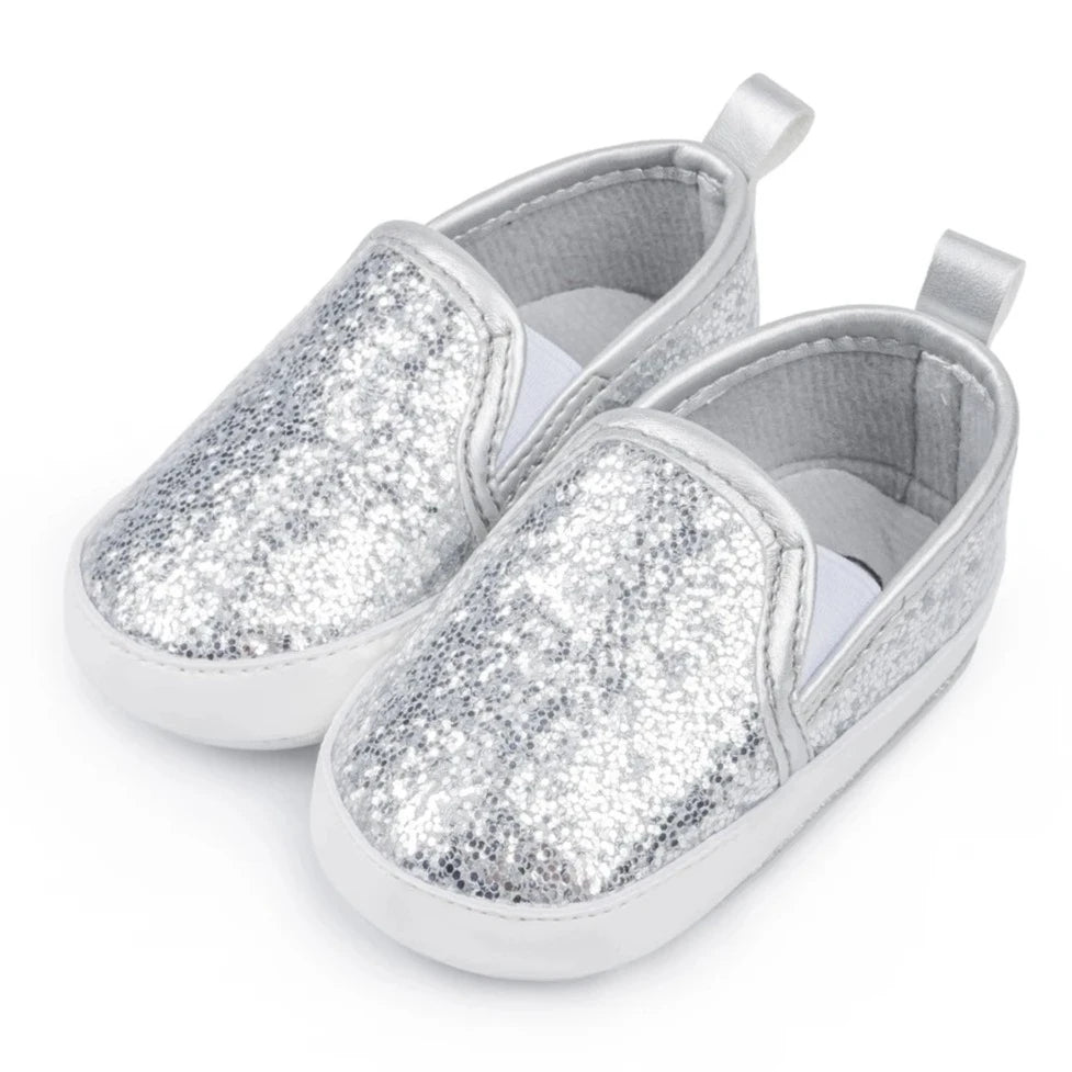 Not only will your little angel look fashionable in these stylish gold, silver and white baby loafers, but they will also stay safe and comfortable with their anti-slip, soft-sole design. Perfect for newborns up to 18 months, these shoes are easy to put on and take off, making your life as a busy parent a little easier. Provide your child with both fashion and function with our sparkling loafers in multiple colors and sizes.