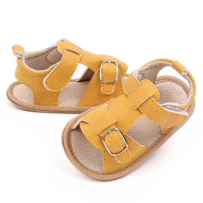 Bring comfort and style to your little one's summer with these adorable sandals in vibrant yellow, crisp white, and cool blue. Perfect for newborns to 18-month-olds, these sandals will have your baby looking cute from every angle. Elevate your baby's style with these adorable and versatile sandals! Keep your little one's feet cool and comfortable all summer long with these must-have sandals