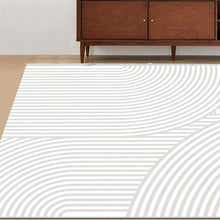 Load image into Gallery viewer, This grey geometric rug is the perfect option for your child&#39;s bedroom. Made from high-quality polyester, it&#39;s designed to last while providing a modern, minimalistic aesthetic. Soft yet durable, it comes in multiple colors and is easy to clean, making it ideal for any home.
