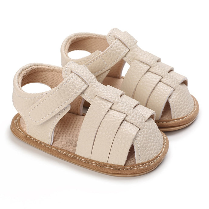Let your little one embrace summer days in style! Our beach beige sandals for babies and tots offer a perfect balance of comfort and fun, and come in a range of beautiful colors. Put a smile on your baby's face! Upper Material: Cotton  Outsole Material: Rubber Heel Type: Flat 