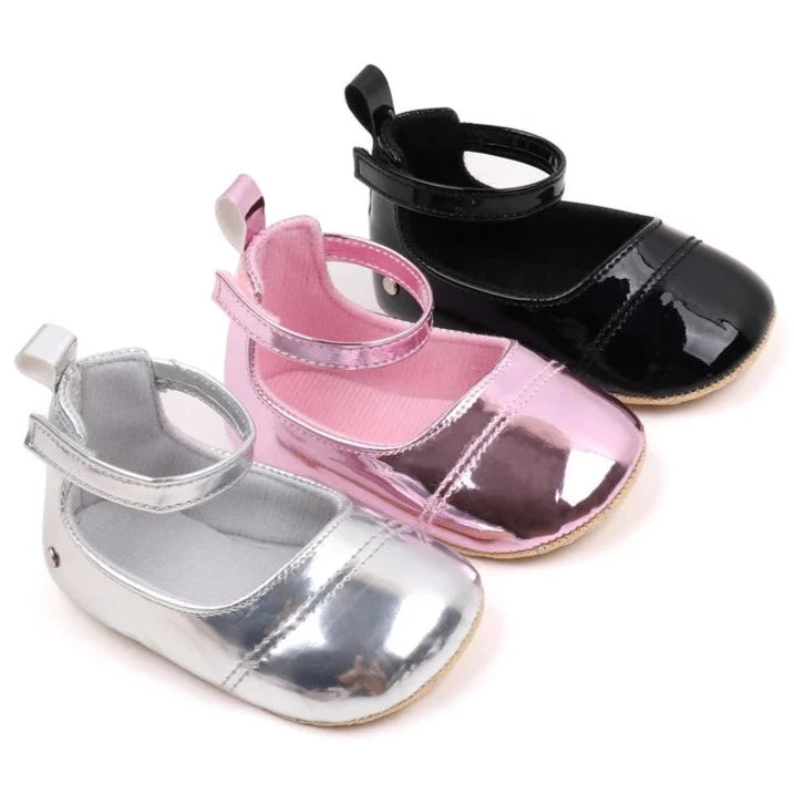 The perfect first time walker shoes for your little walker. Shower your little one's feet with style and comfort with our Bling Baby Shoes | Multiple Colors! Designed for newborns to 18 months, these shoes are perfect for your child's first steps. Supportive and durable, they'll keep your little walker's feet protected as they explore the world. Give them the confidence to take those first steps with our Bling Baby Shoes