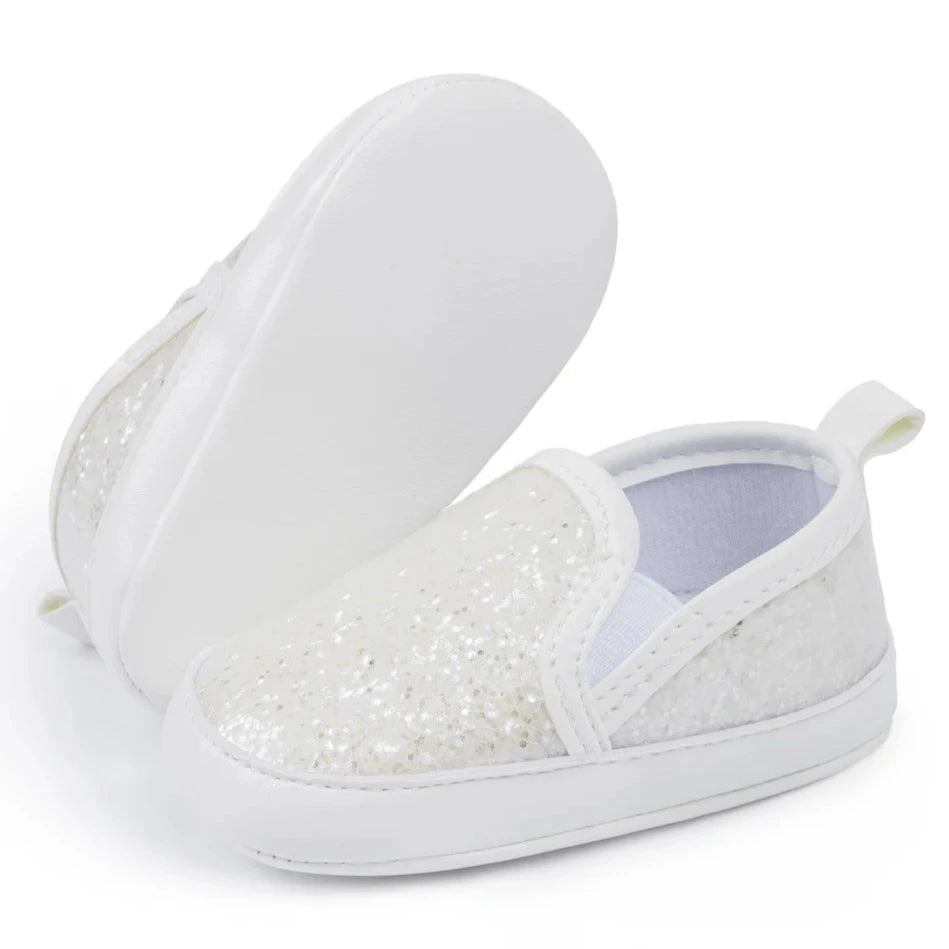 Not only will your little angel look fashionable in these stylish gold, silver and white baby loafers, but they will also stay safe and comfortable with their anti-slip, soft-sole design. Perfect for newborns up to 18 months, these shoes are easy to put on and take off, making your life as a busy parent a little easier. Provide your child with both fashion and function with our sparkling loafers in multiple colors and sizes.