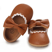 Load image into Gallery viewer, Indulge your little one&#39;s feet with our adorable Mary Jane baby shoes in a selection of sweet colors. Perfect for newborns through 18 months old, choose from white, black, apricot, and brown to match any outfit.
