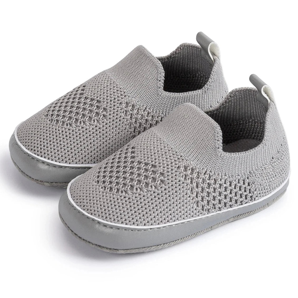 Easily breathable and featherlight infant shoes in shades of pink, white, and grey; perfect for newborns up to 18 months of age.