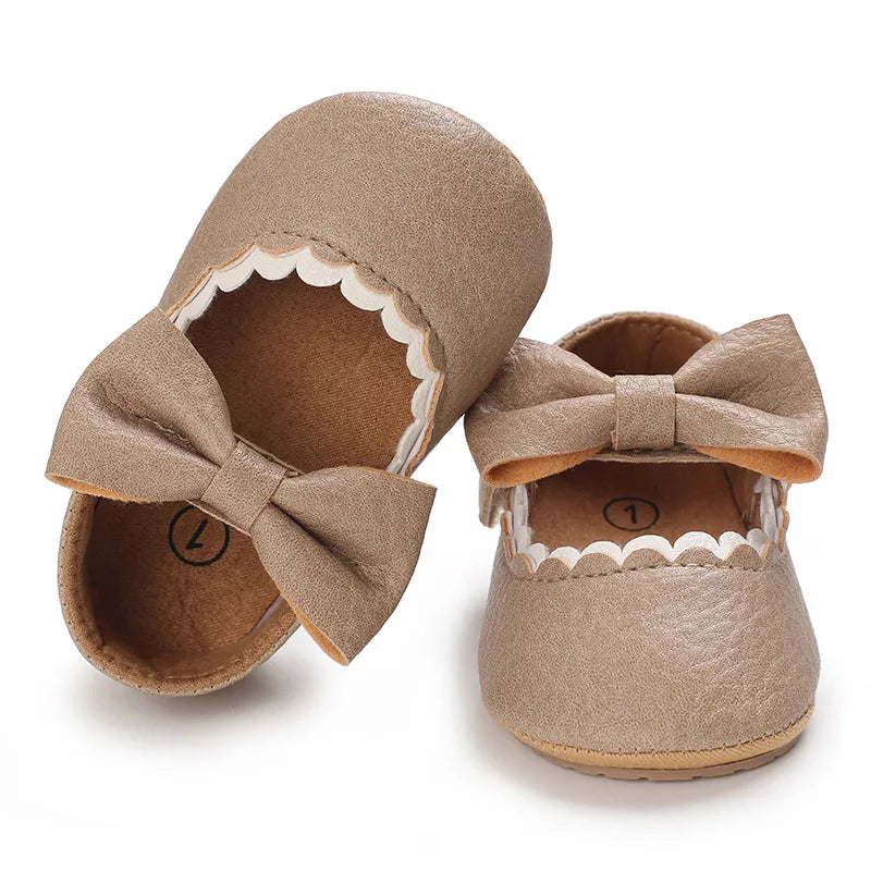 Indulge your little one's feet with our adorable Mary Jane baby shoes in a selection of sweet colors. Perfect for newborns through 18 months old, choose from white, black, apricot, and brown to match any outfit.