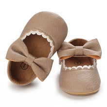 Load image into Gallery viewer, Indulge your little one&#39;s feet with our adorable Mary Jane baby shoes in a selection of sweet colors. Perfect for newborns through 18 months old, choose from white, black, apricot, and brown to match any outfit.
