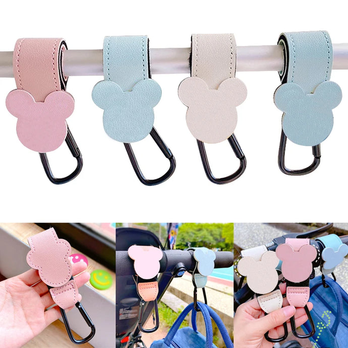 This high-quality Mickey Mouse Baby Bag Stroller Hook is made of PU leather and is available in mint, pink, black, red, and beige.