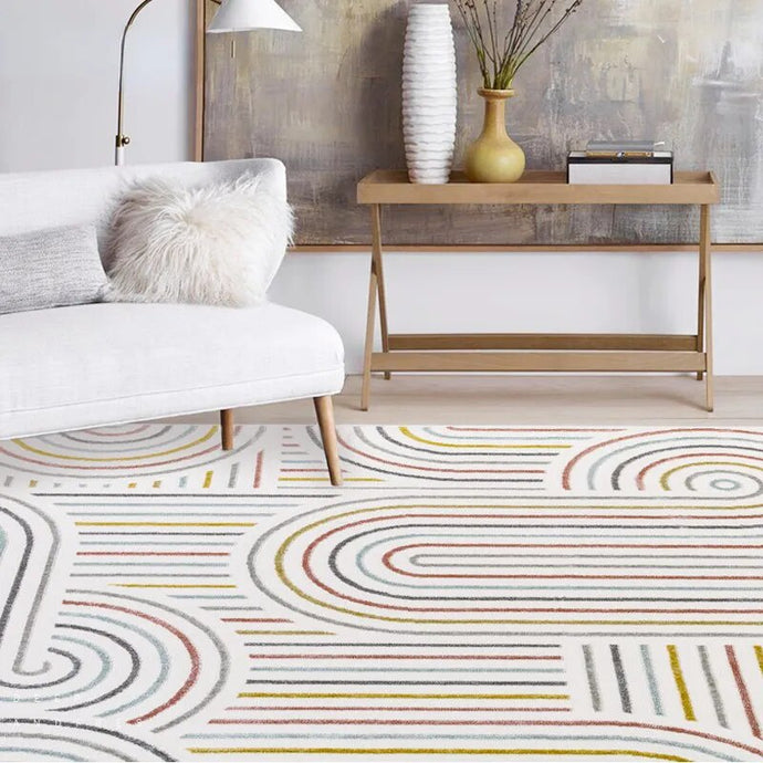 Transform your child's bedroom into a stunning work of art with the minimalist geo swirl rug, an elegant and exclusive piece that elevates any bedroom. Crafted from premium materials and available in multiple sizes, this vivid rug is sure to captivate with its timeless swirl design. An exquisite addition to any home.