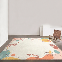 Load image into Gallery viewer, Our soft flower rug is the perfect addition to any kid&#39;s bedroom. It features an easy to clean modern floral design with pink, beige, yellow and blue polyester, designed to bring a touch of elegance and luxury to your space. With its sophisticated look and exclusive style, this rug will be a timeless statement piece, sure to be enjoyed for years to come.
